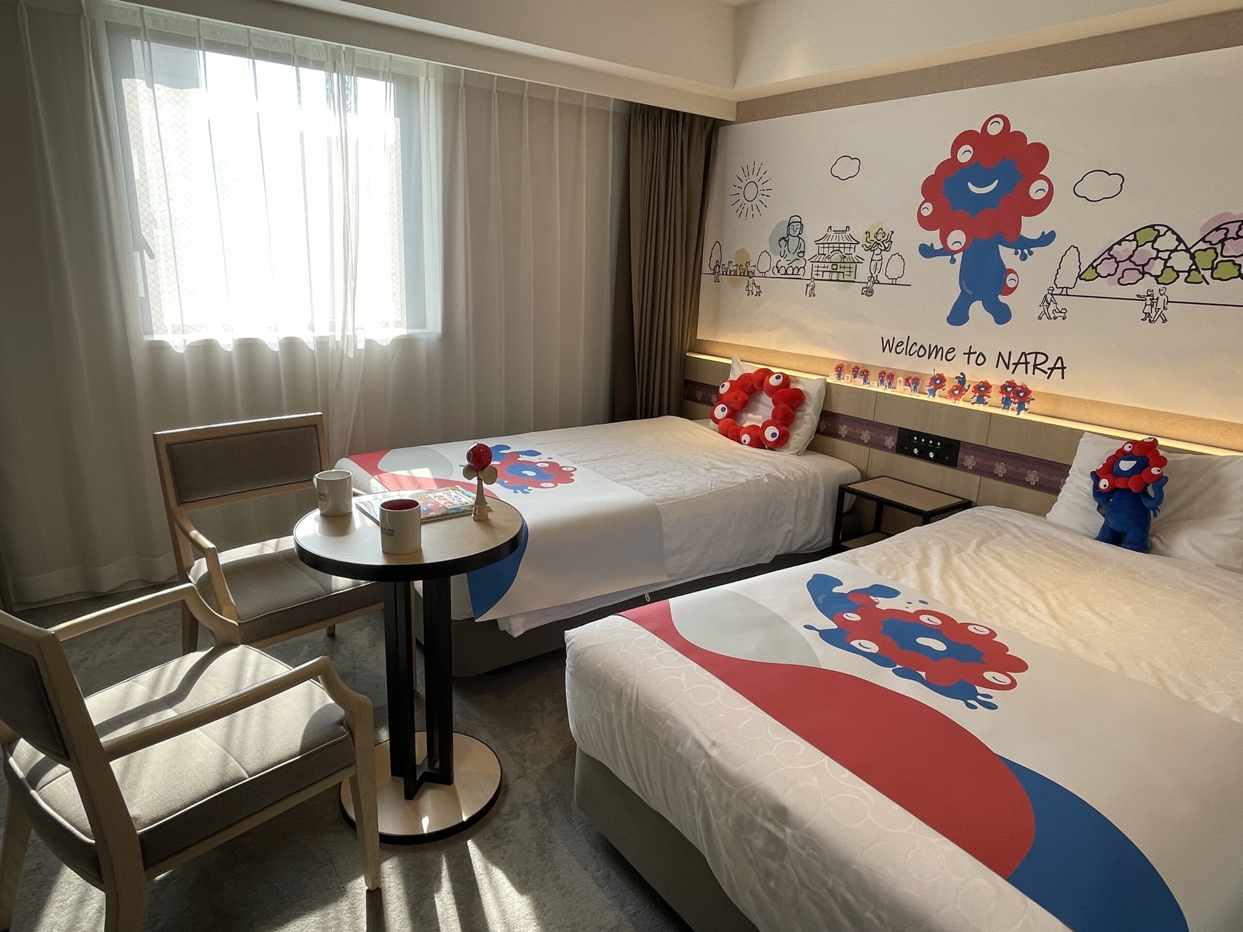 The first hotel collaboration with the official character of the Osaka Kansai Expo, 'Myakumyaku,' the 'Myakumyaku Collaboration Room' is now available at 6 Henn na Hotel locations in the Kansai area.