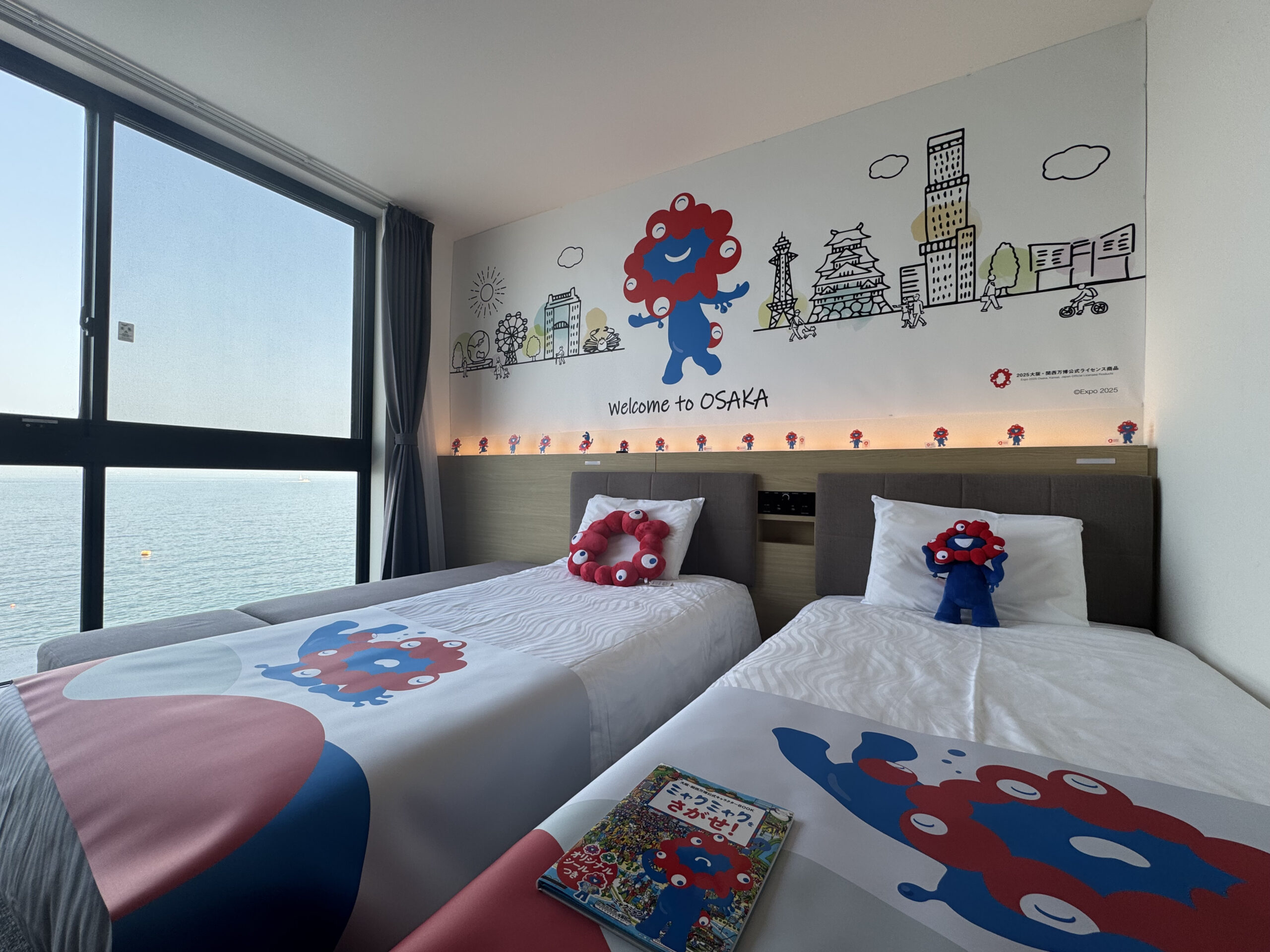 The first hotel collaboration with the official character of the Osaka Kansai Expo, 'Myakumyaku,' the 'Myakumyaku Collaboration Room' is now available at 6 Henn na Hotel locations in the Kansai area.