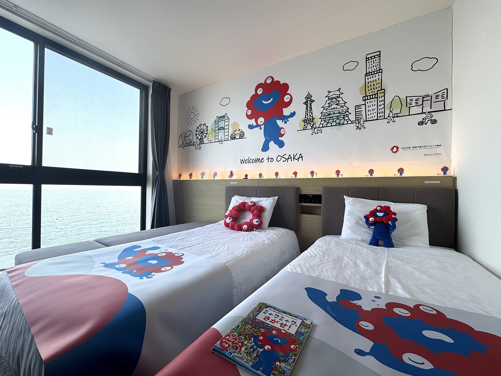 The first hotel collaboration with the official character of the Osaka Kansai Expo, 'Myakumyaku,' the 'Myakumyaku Collaboration Room' is now available at 6 Henn na Hotel locations in the Kansai area.